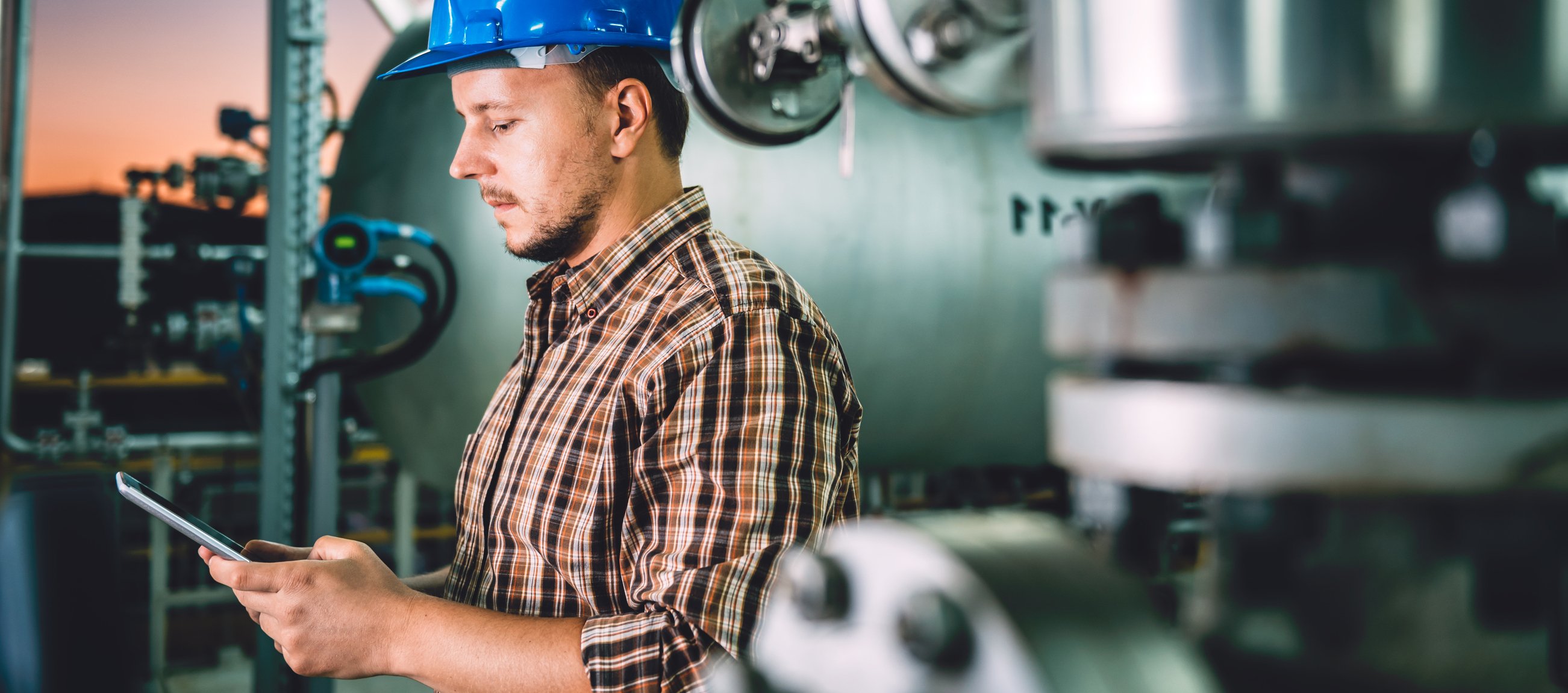 oil worker on tablet